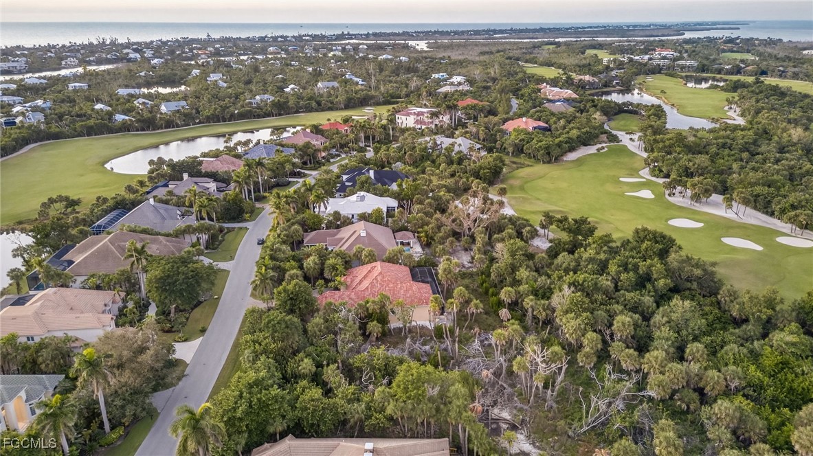 2372 Wulfert Road Sanibel, FL 33957 - Photo 6 of 12 an aerial view of city and lake with trees