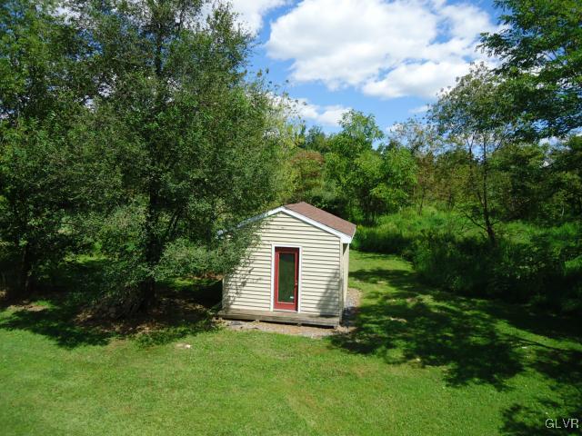 2224 Yost Road Bath, PA 18014 - Photo 8 of 34 a front view of a house with a garden