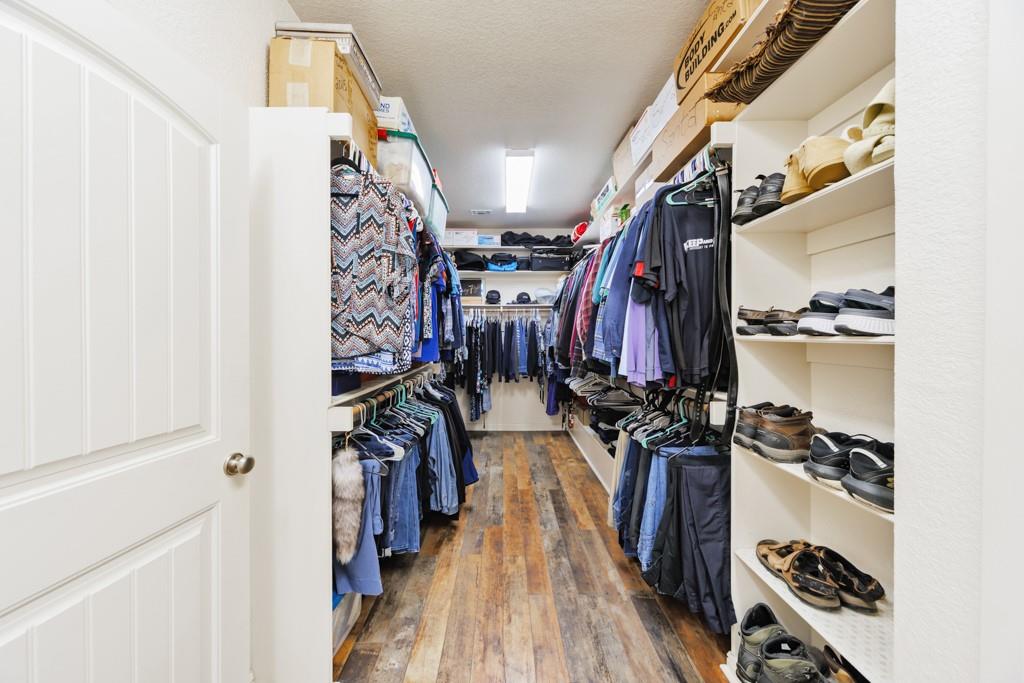 433 Fruitland Road Bowie, TX 76230 - Photo 26 of 40 a view of walk in closet with clothes and shoes