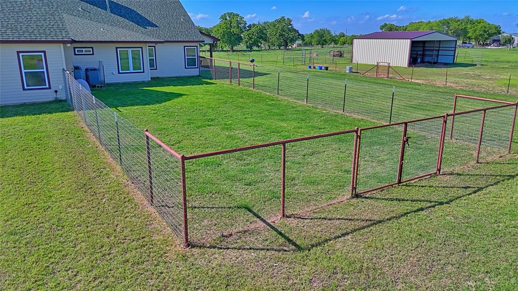 433 Fruitland Road Bowie, TX 76230 - Photo 30 of 40 a view of a backyard with a garden