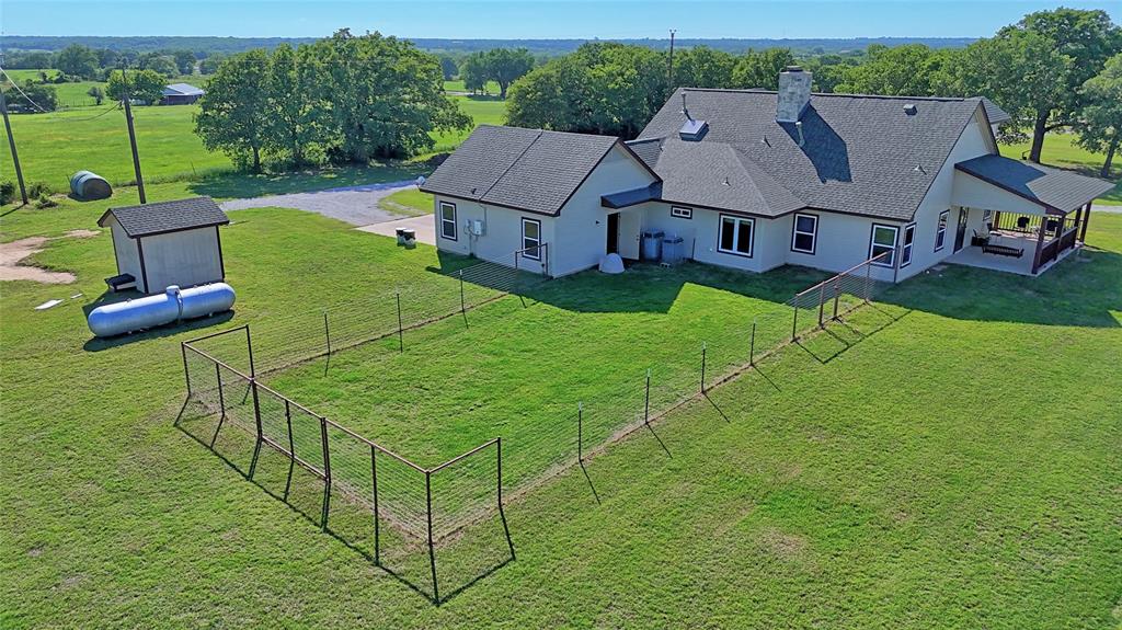 433 Fruitland Road Bowie, TX 76230 - Photo 31 of 40 an aerial view of a house with pool table and chairs