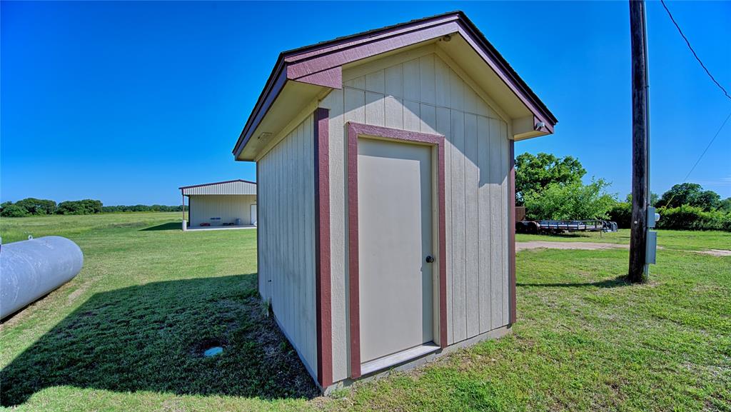 433 Fruitland Road Bowie, TX 76230 - Photo 33 of 40 a front view of a house with a yard