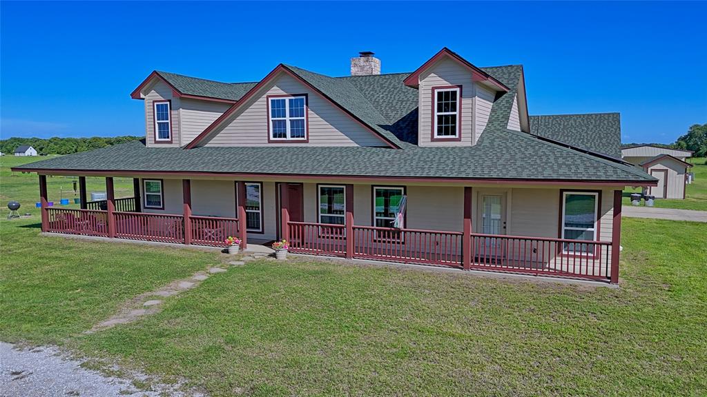433 Fruitland Road Bowie, TX 76230 - Photo 34 of 40 a front view of a house with garden