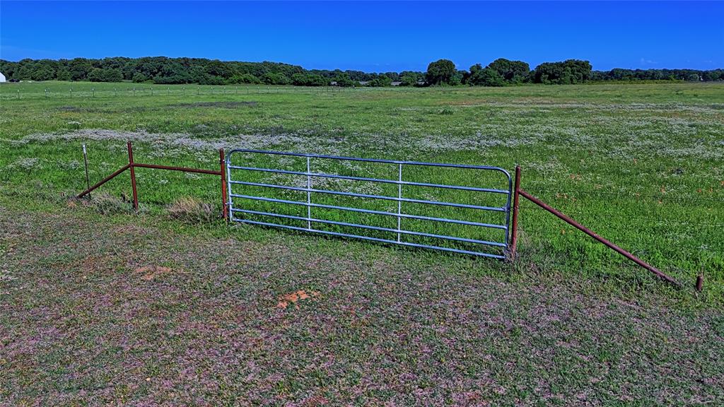 433 Fruitland Road Bowie, TX 76230 - Photo 36 of 40 a view of a field with a fence
