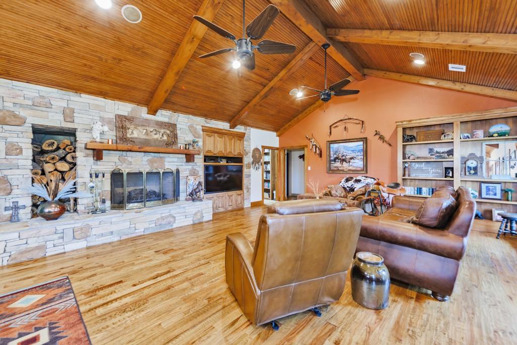 433 Fruitland Road Bowie, TX 76230 - Photo 9 of 40 a living room with lots of furniture and a chandelier