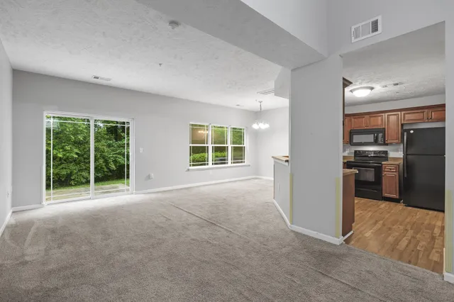 a kitchen with stainless steel appliances granite countertop a sink stove and microwave