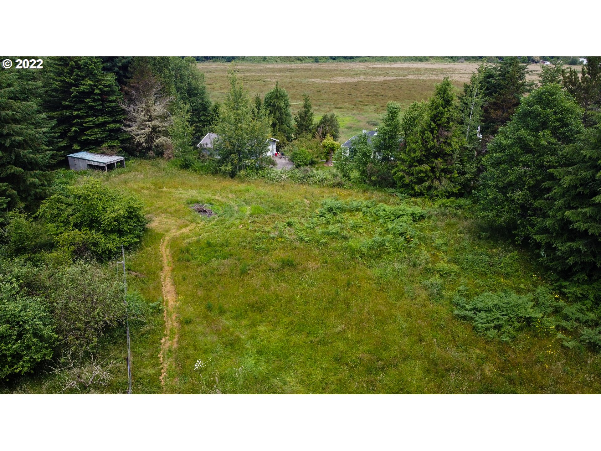 Sylvandale Astoria, OR 97103 - Photo 4 of 10 a black and white photo of a green field