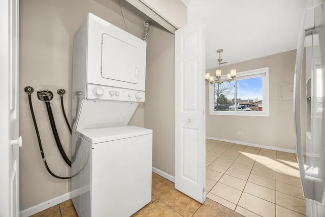 a view of a storage & utility room with fridge