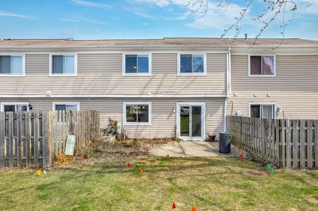a swimming pool with outdoor seating