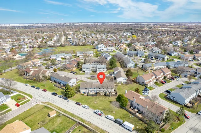 an aerial view of residential houses with outdoor space