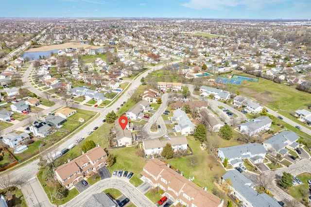 an aerial view of residential houses with outdoor space