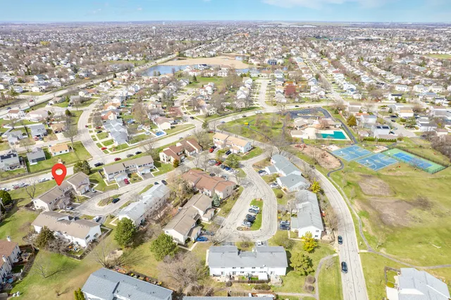 an aerial view of residential houses with outdoor space