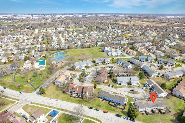 an aerial view of residential houses with outdoor space