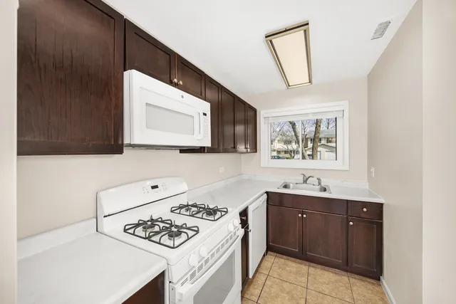 a kitchen with a cabinets and a stove top oven