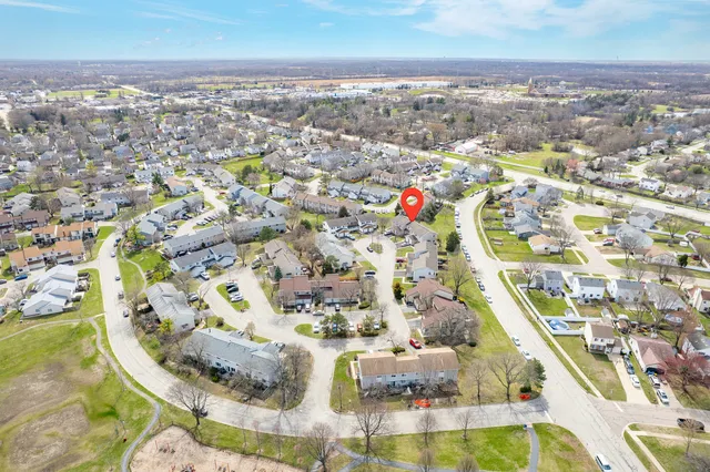 an aerial view of residential houses with outdoor space