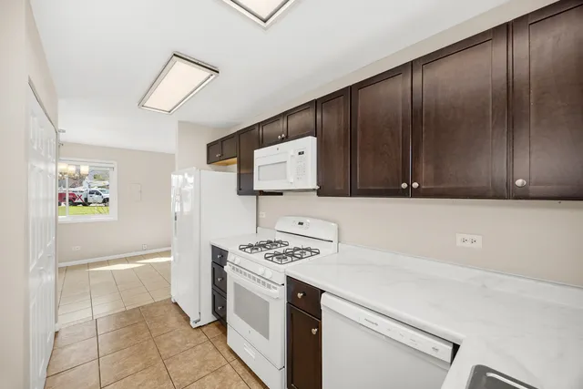 a kitchen with a cabinets and a stove top oven