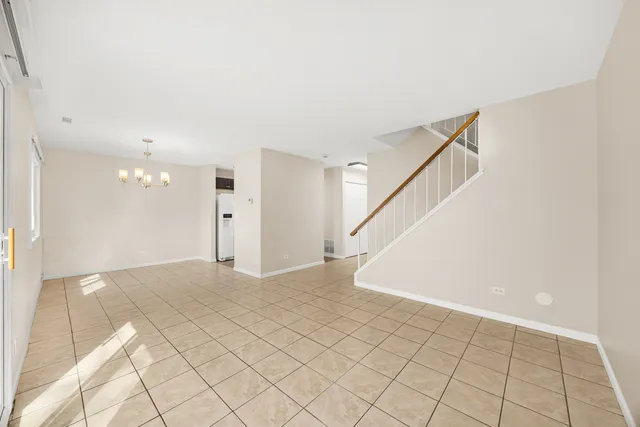 a view of an empty room with white walls