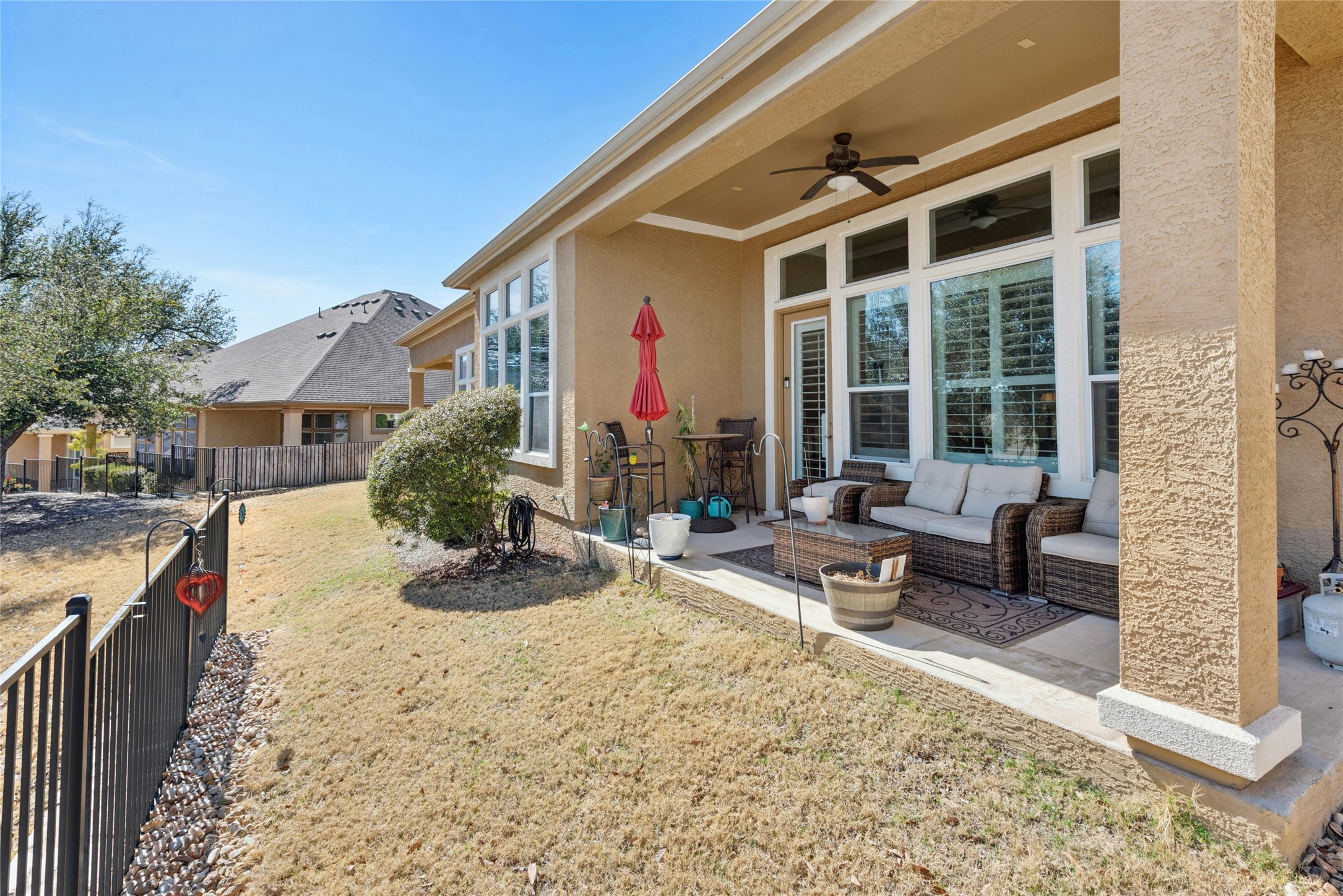 116 Evolutions Path Lakeway, TX 78738 - Photo 30 of 34 View of yard featuring outdoor seating, a ceiling fan, and a patio area