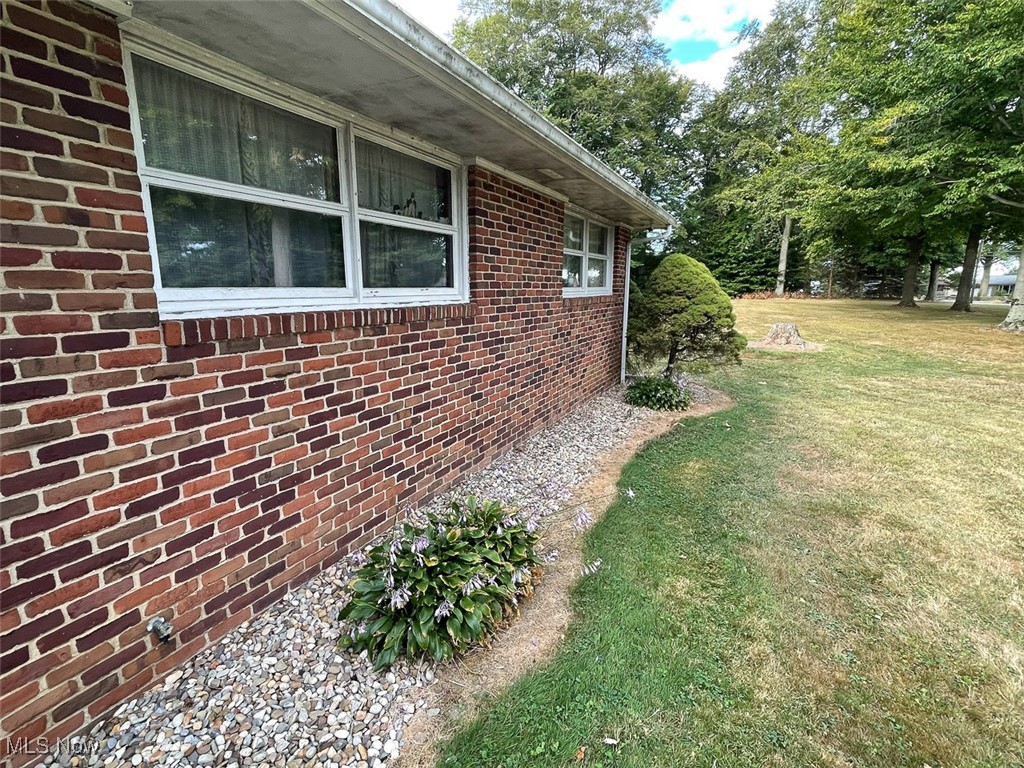 5990 Meese Road Northeast Louisville, OH 44641 - Photo 10 of 16 View of front of home featuring a lawn and brick siding