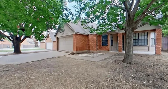a house with a tree in front of it