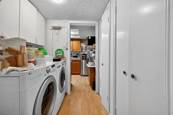a kitchen with stainless steel appliances a sink stove and cabinets