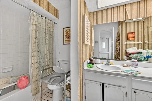 a bathroom with a sink double vanity and a mirror