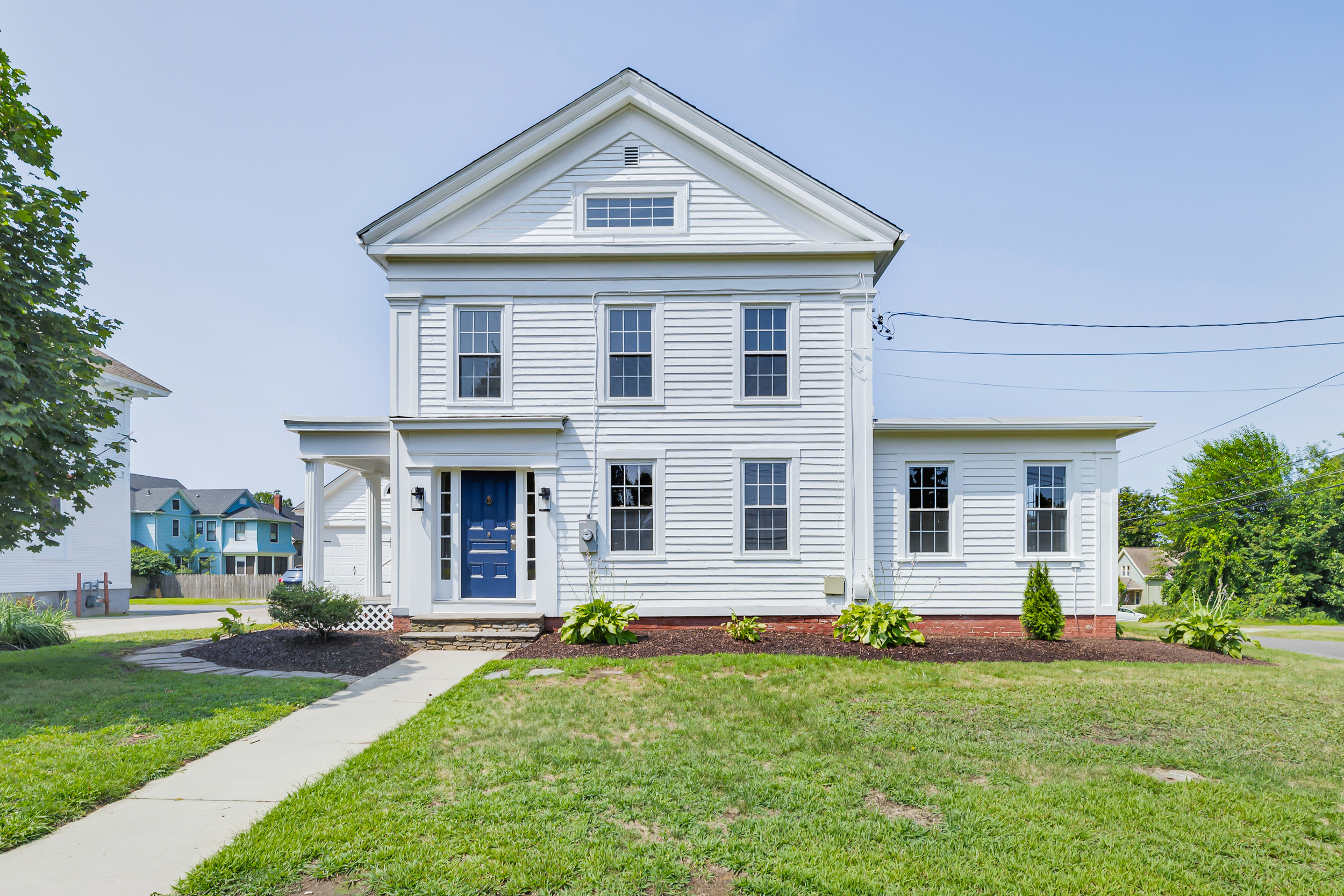 1070 Enfield Street Enfield, CT 06082 - Photo 1 of 35 a front view of a house with a yard and garage