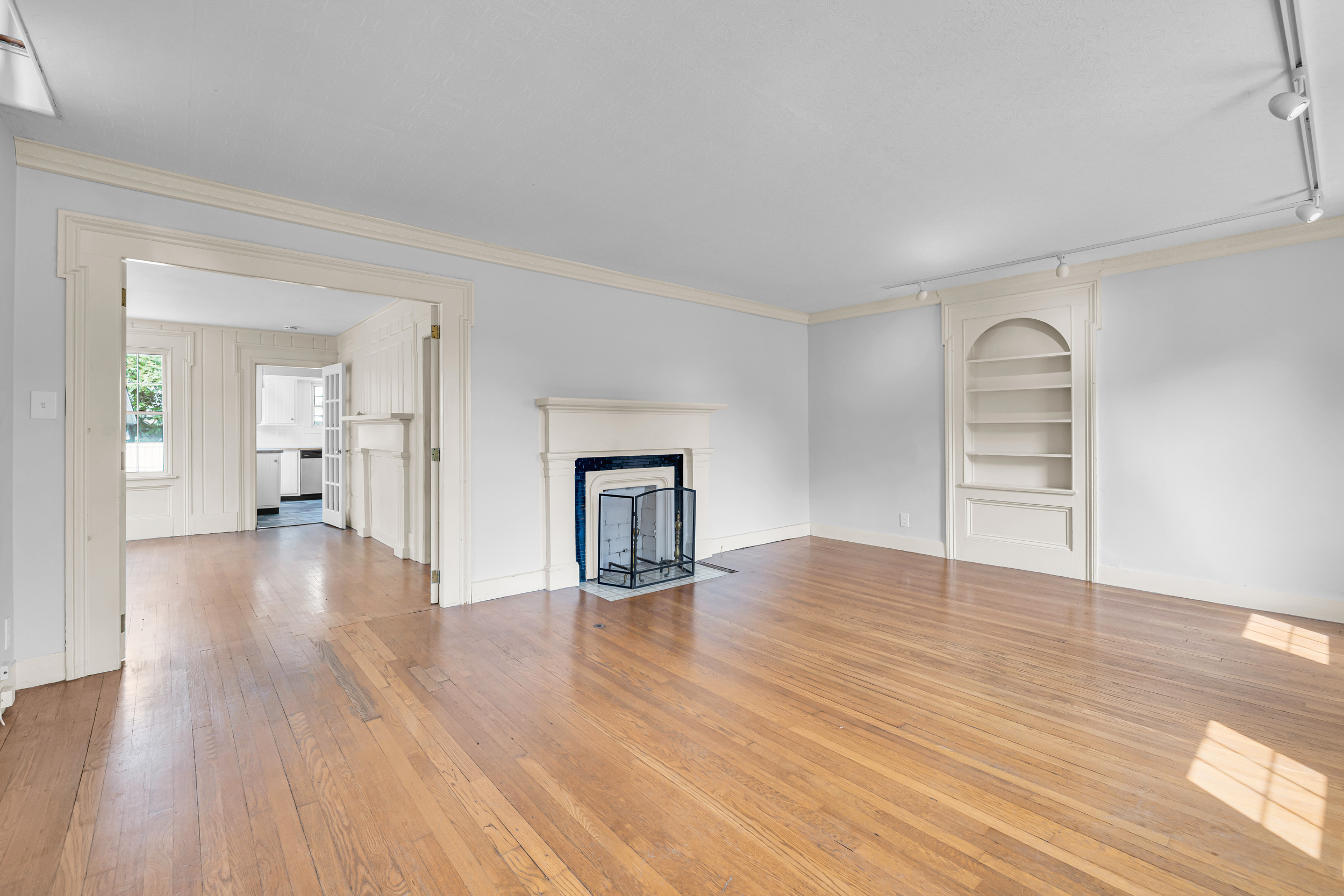1070 Enfield Street Enfield, CT 06082 - Photo 12 of 35 a view of empty room with wooden floor and window