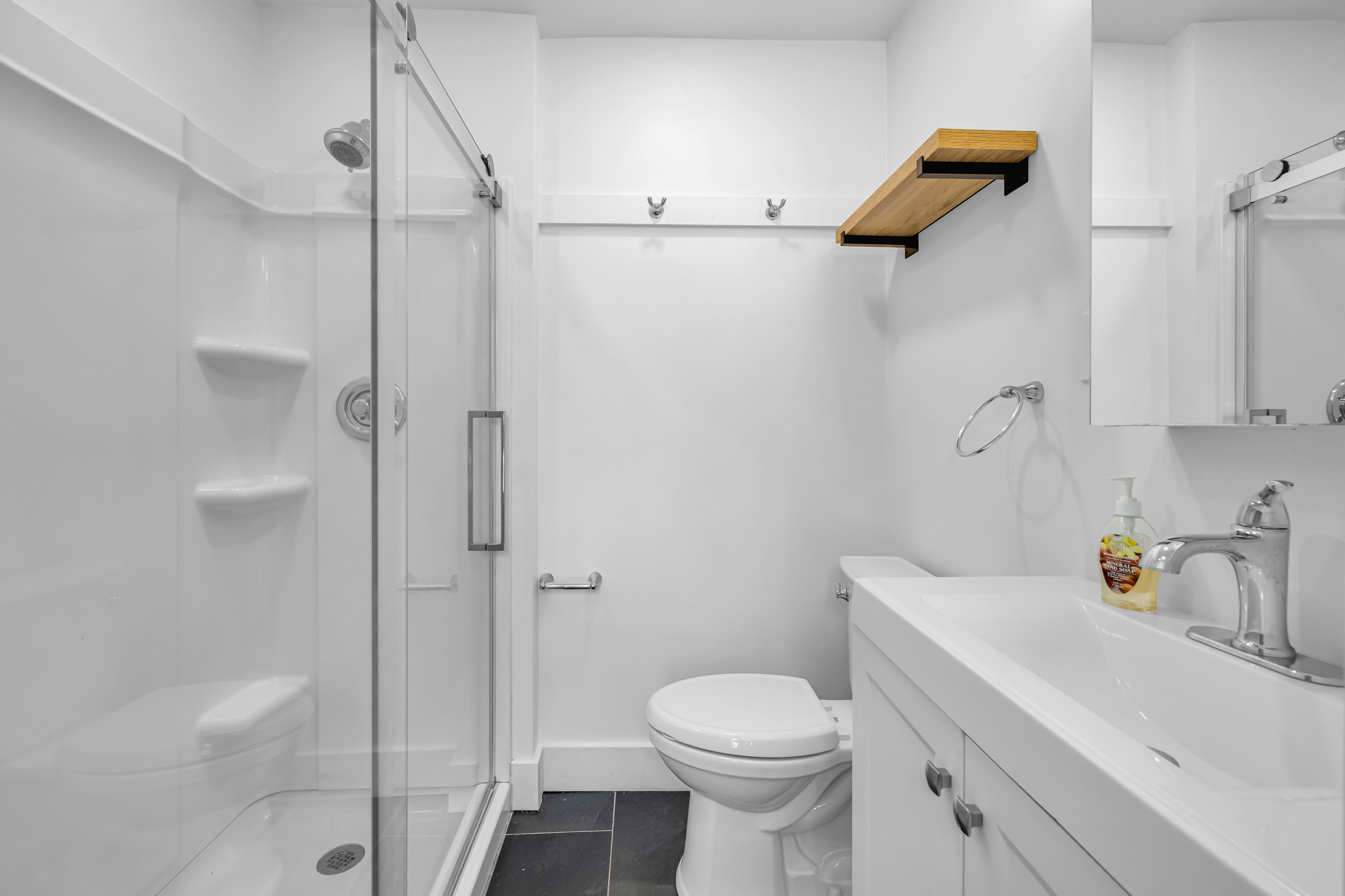 1070 Enfield Street Enfield, CT 06082 - Photo 18 of 35 a bathroom with a sink a toilet and shower