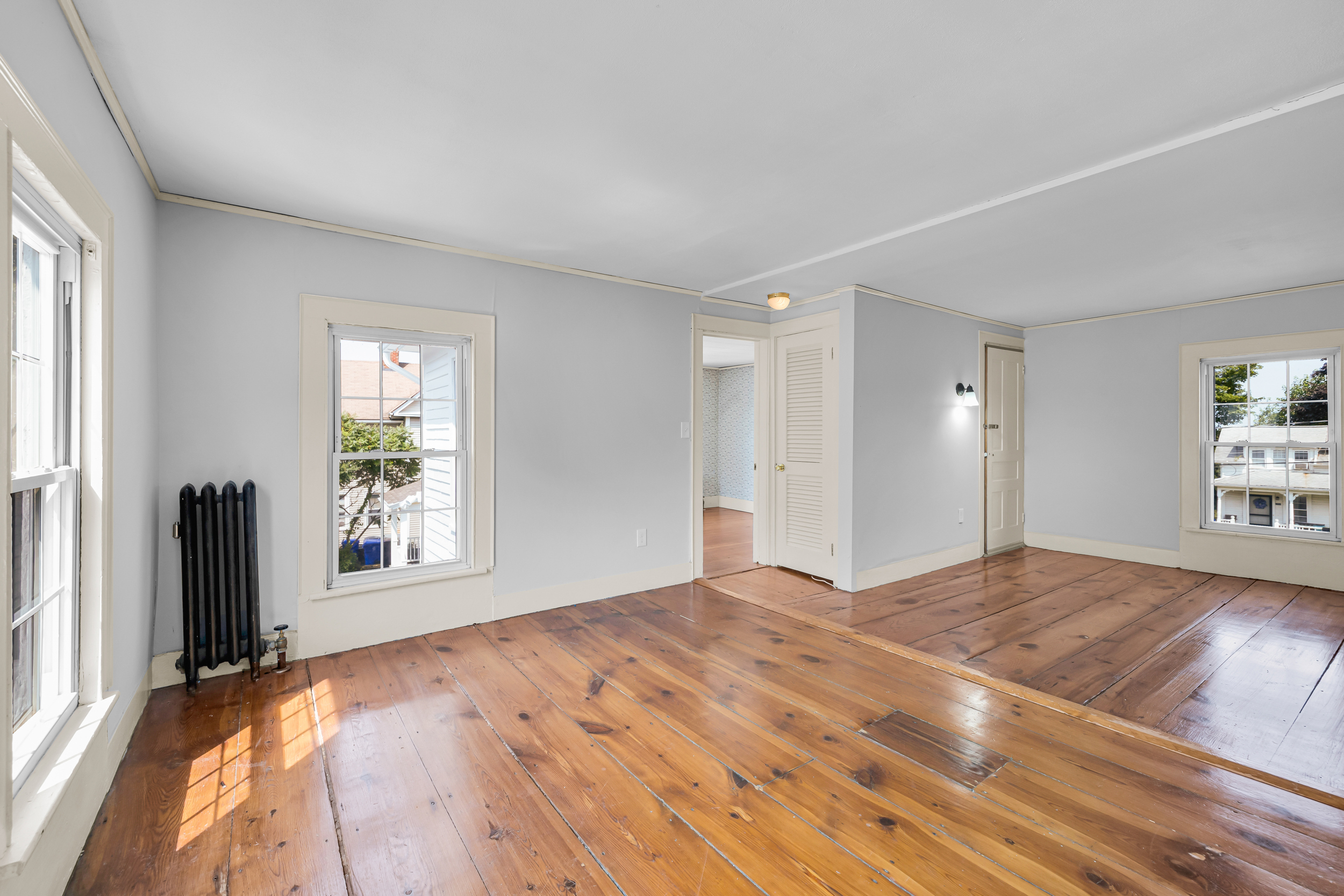 1070 Enfield Street Enfield, CT 06082 - Photo 20 of 35 a view of empty room with window and wooden floor