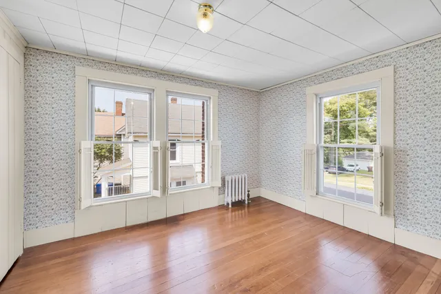 a view of a livingroom with wooden floor