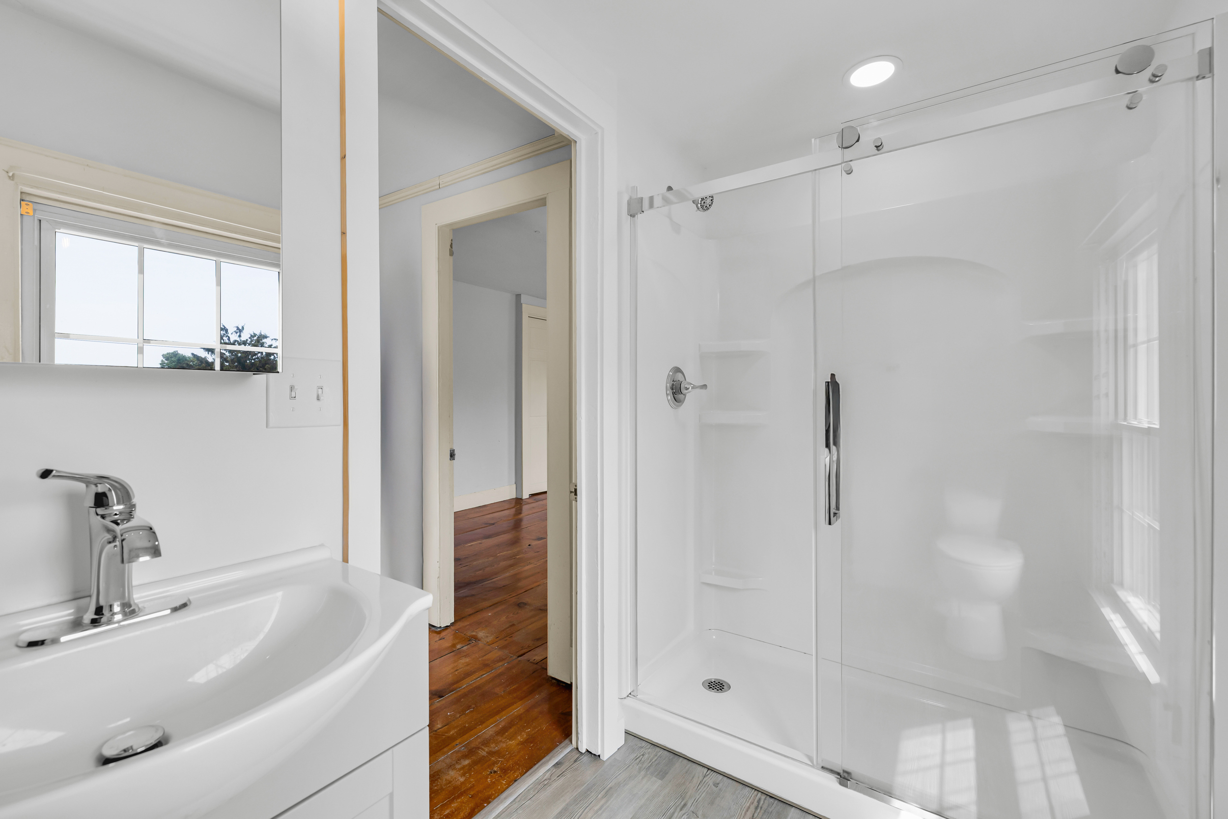 1070 Enfield Street Enfield, CT 06082 - Photo 29 of 35 a bathroom with a bathtub and a shower