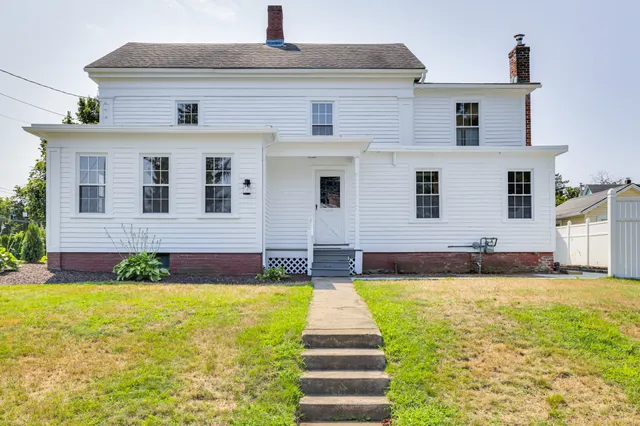 a view of a backyard with sitting area