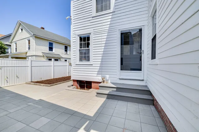 a view of a house with a small yard