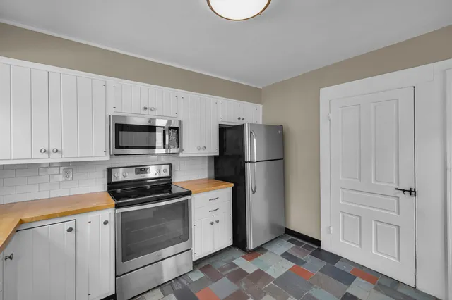 a view of livingroom with hardwood floor and hallway