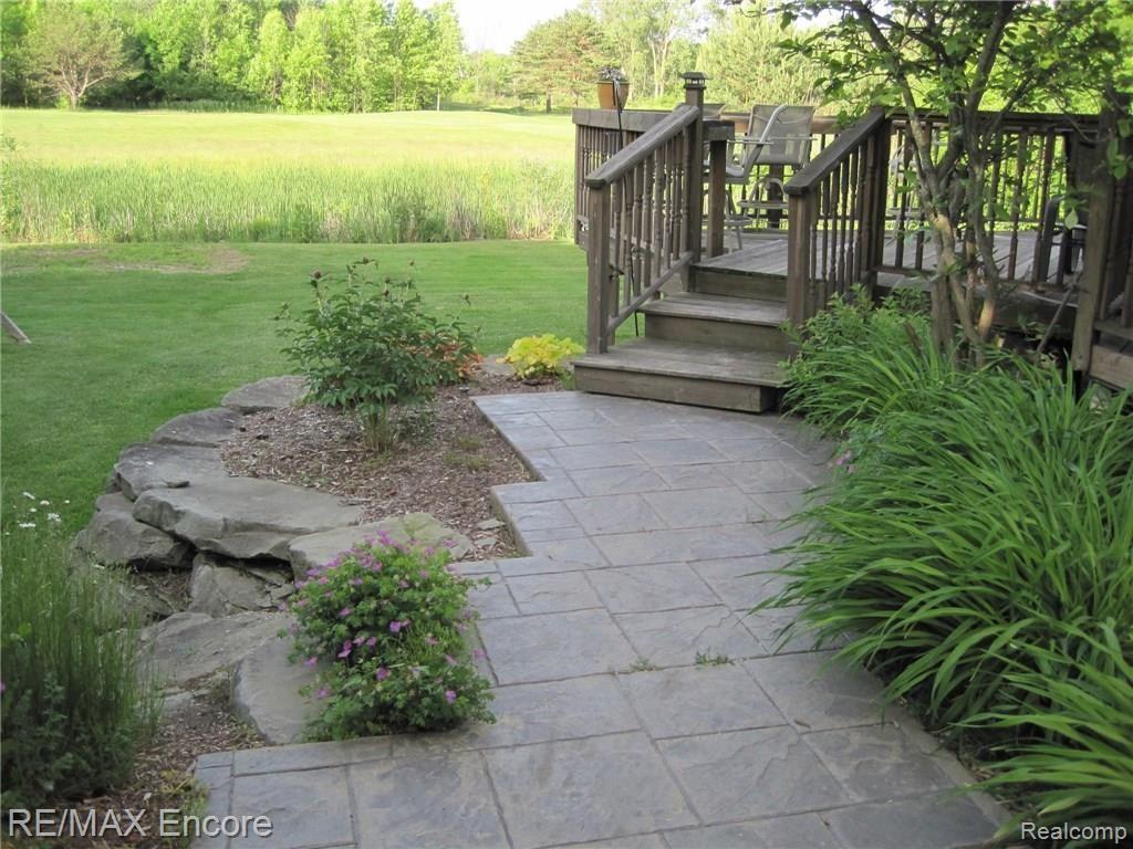 6787 Oakhurst Ridge Road Clarkston, MI 48348 - Photo 29 of 37 Stamped Concrete Walkway