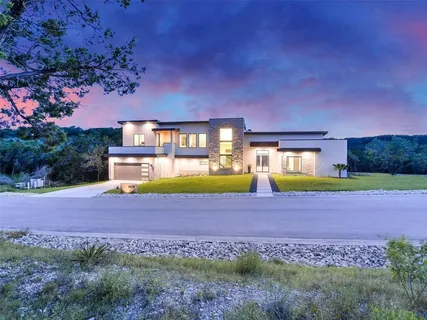 a view of a big house with a big yard