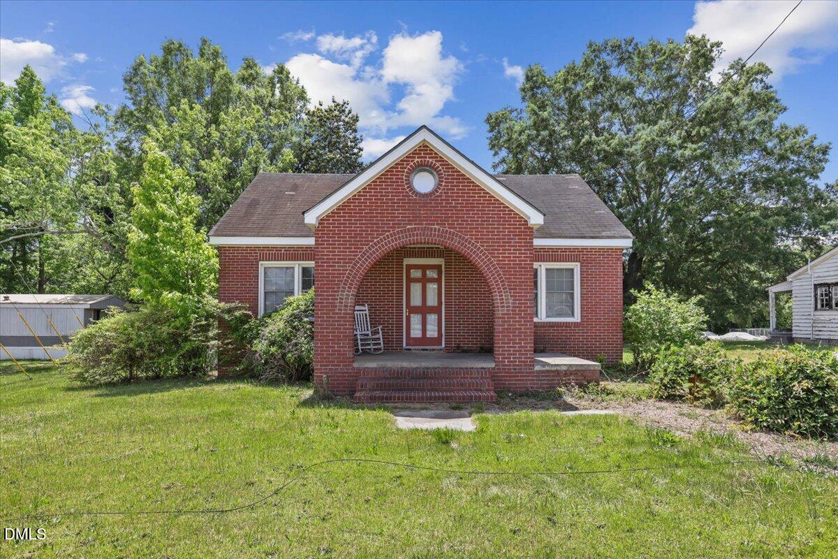 2213 Hunter Hill Road Rocky Mount, NC 27804 - Photo 1 of 11 a front view of a house with garden