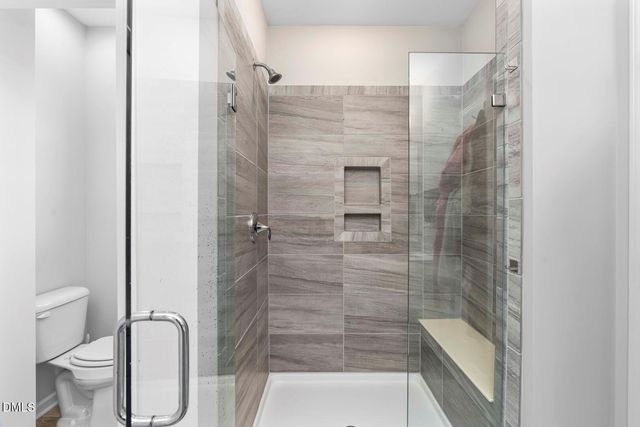 a large white bed in a white room