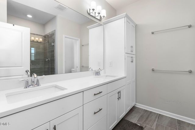 a bathroom with a shower and toilet