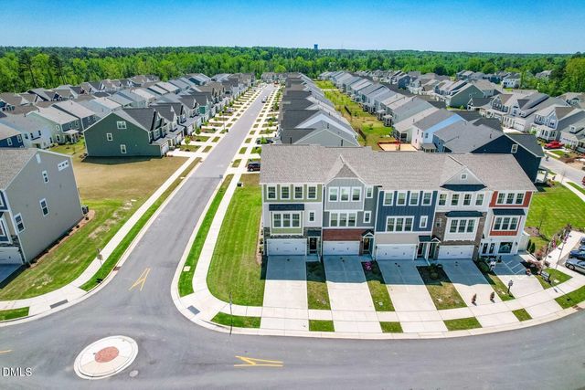 a view of swimming pool with outdoor seating and city view