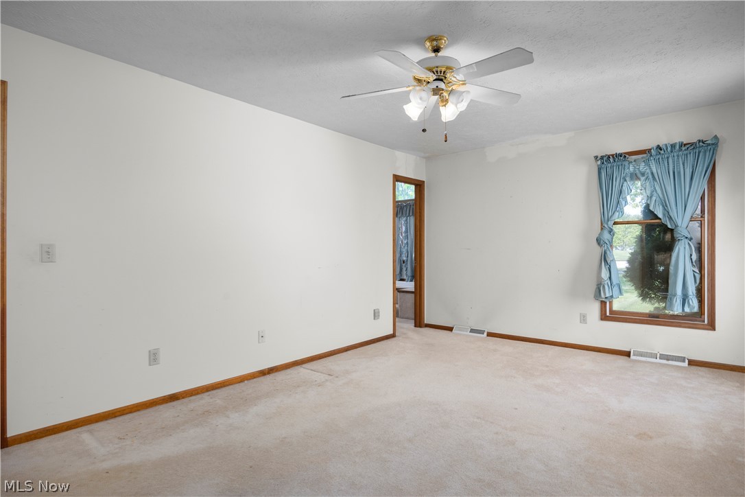 722 Jaycox Road Avon Lake, OH 44012 - Photo 25 of 48 Carpeted interior space featuring light-colored walls and wood-finish trim