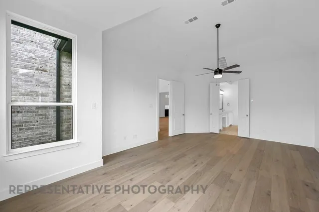 a bathroom with a sink double vanity granite tub and a mirror