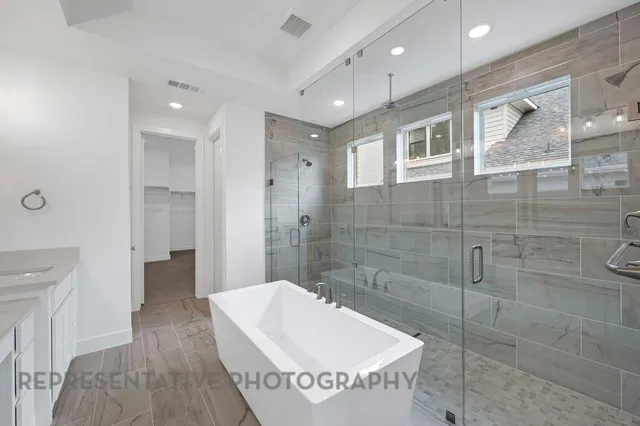 a view of a hallway with wooden floor and entryway