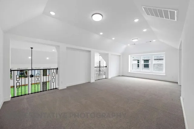 a view of a house with a yard and garage