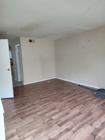 a view of wooden floor and staircase in a room