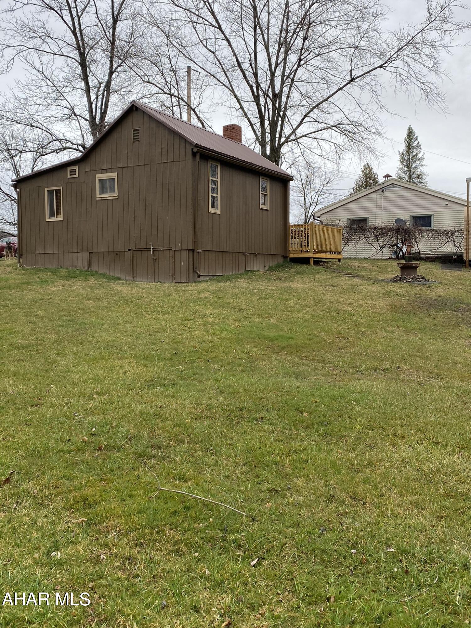 157 Stuckeysville Road Manns Choice, PA 15550 - Photo 23 of 28 a front view of a house with a yard