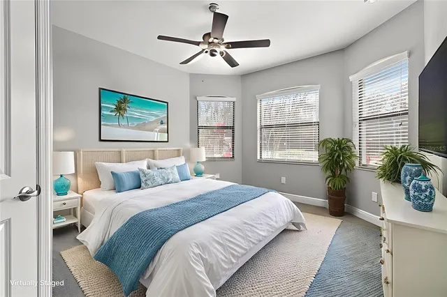 a bedroom with a bed dresser and window