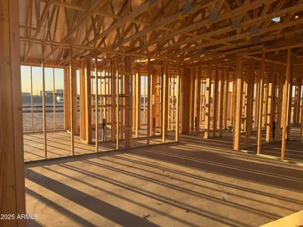 a view of a room with windows and stairs