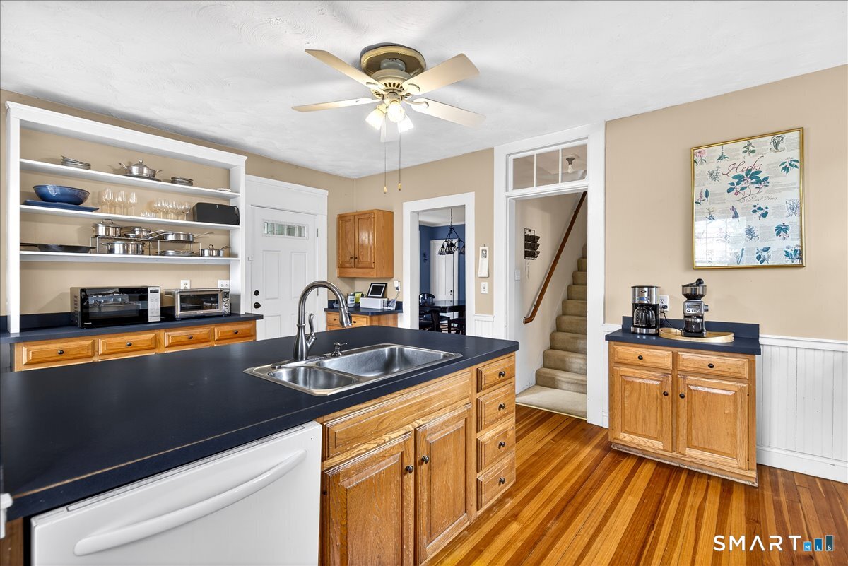 95 Clark Street New Haven, CT 06511 - Photo 12 of 39 a kitchen with stainless steel appliances granite countertop a sink dishwasher stove and refrigerator with wooden floor
